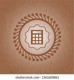 calculator icon inside retro style wood emblem