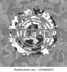 Calculator on grey camouflaged texture