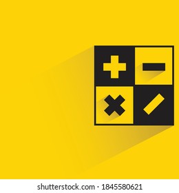 calculator with shadow on yellow background