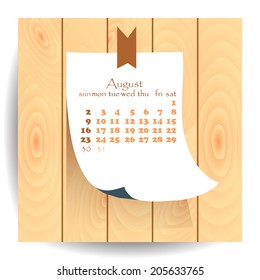 Calendar 2015 August: label sheet of paper on the wooden textured background.