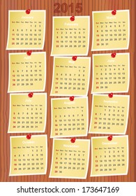 calendar 2015 on notes pinned to wooden board