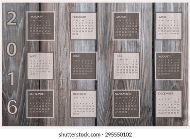 Calendar for 2016 on wood background.