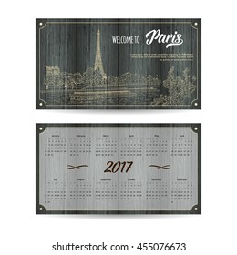 Calendar 2017 with city sketching Paris, France on wood background. Vector illustration for your design