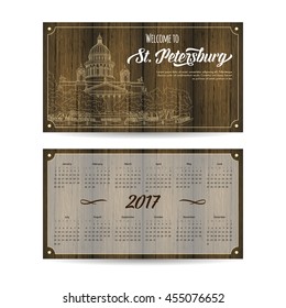 Calendar 2017 with city sketching Saint Petersburg, Russia on wood background. Vector illustration for your design