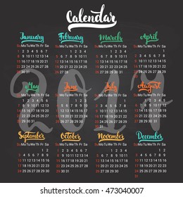 Calendar 2017 design template vector isolated on the black chalkboard background. The first day of the week is Sunday. Set of 12 months lettering inscription, separate on colorful season.