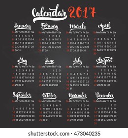 Calendar 2017 design template vector isolated on the black chalkboard background. The first day of the week is Sunday. Set of 12 months lettering inscription.