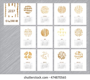Calendar 2017 with hand drawn textures. Unique design for each month. Vector planner with geometric figures: stripes, triangles, circles, dots, flowers and leaves.