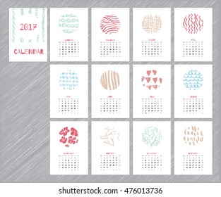 Calendar 2017 with hand drawn textures. Unique design for each month. Vector planner with geometric figures: stripes, triangles, circles, dots, flowers and leaves.