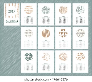 Calendar 2017 with hand drawn textures. Unique design for each month. Vector planner with geometric figures: stripes, triangles, circles, dots, flowers and leaves.
