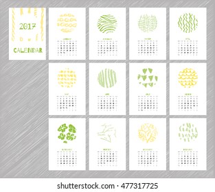 Calendar 2017 with hand drawn textures. Unique design for each month. Vector planner with geometric figures: stripes, triangles, circles, dots, flowers and leaves.