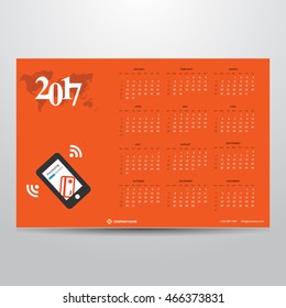 Calendar for 2017 on Orange background. mobile payment Technology Banner with world map transparent background. Week Starts Sunday. Vector Design Print Template