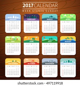 Calendar for 2017 on Wooden Background. Week Starts Sunday. Vector Template with seasons. For web and print design. Vector illustration. Vertical orientation. Every month has own illustration or icon