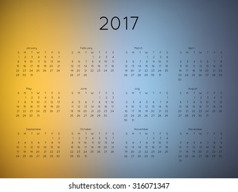 Calendar 2017 year with blurred background. Week starts from Sunday