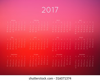 Calendar 2017 year with blurred background. Week starts from Sunday