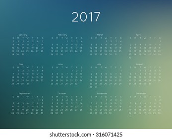 Calendar 2017 year with blurred background. Week starts from Sunday