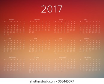 Calendar 2017 year with blurred background. Week starts from monday