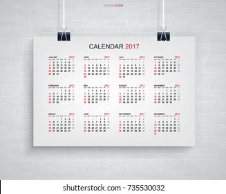 Calendar 2017 year on white poster hanging with brick wall background. Vector illustration.