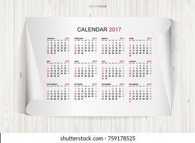 Calendar 2017 year on white paper and wooden texture background. Week starts from Sunday. Vector illustration idea.