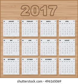 calendar 2017 year. paper sheet on wooden boards. Week starts with Sunday. Vector image.