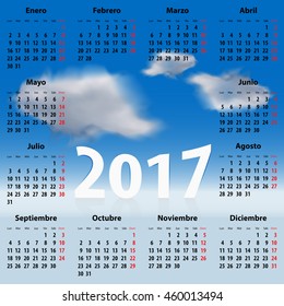 Calendar for 2017 year in Spanish with clouds in the blue sky. Mondays first. Vector illustration