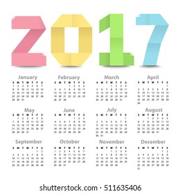 Calendar of 2017 year. Week starts from Sunday. Vector abstract illustration of a  color handmade paper origami number 2017 on white background. Simple template.