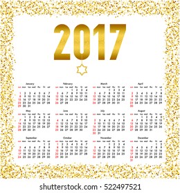 Calendar for 2017 year. Week starts Sunday. Yearly calendar template with text 2017 and star with gold glitter effect.
