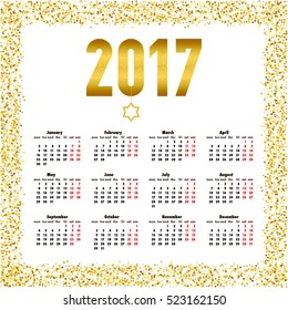Calendar for 2017 year. Week starts Monday. Yearly calendar template with text 2017 and star with gold glitter effect.