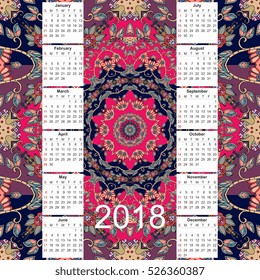Calendar for 2018 year on ethnic ornamental background. Mandala pattern. Week starts on sunday. Vector template. 