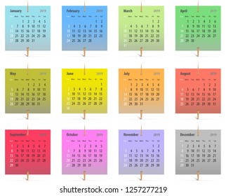 Calendar for 2019 in English on colorful stickers attached with toothpicks. Vector illustration
