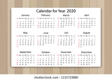 Calendar 2020 year in simple style on wooden texture background. Week starts from Sunday. Vector illustration.