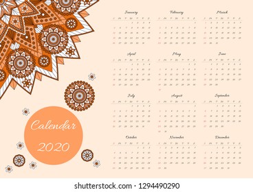Calendar for 2020 year. Vector template with ornamental mandala on light orange background.