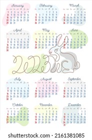 Calendar 2023 with an outline image of the symbol of the year Rabbit in pastel colors. 12 months on one sheet