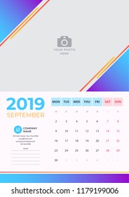 Calendar design for September 2019. Simple blue with orange background. Week starts on Monday. Vector design print template with place for photo.