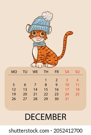Calendar design template for December 2022, the year of the tiger according to the Chinese or Eastern calendar, with the image of tiger with warm blue hat. Table with calendar for December 2022.Vector