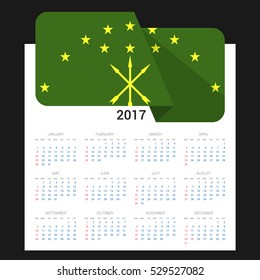 Calendar grid for 2017 with Adygea flag on 2017. National flag on a Black background with shadow. Sundays first. Best for business and office needs. Vector illustration