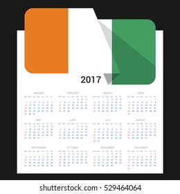 Calendar grid for 2017 with Ivory Coast flag on 2017. National flag on a Black background with shadow. Sundays first. Best for business and office needs. Vector illustration