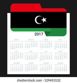 Calendar grid for 2017 with Libya flag on 2017. National flag on a Black background with shadow. Sundays first. Best for business and office needs. Vector illustration