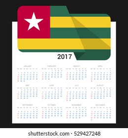 Calendar grid for 2017 with Togo flag on 2017. National flag on a Black background with shadow. Sundays first. Best for business and office needs. Vector illustration