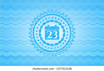calendar icon inside sky blue water wave badge.
