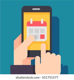 Calendar icon, schedule, planning app on smartphone screen. Hand holds smartphone, finger touches screen. 