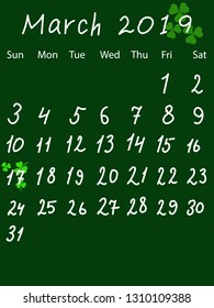 Calendar for March 2019. St. Patrick's Day is marked by clover leaves.  Drawing in chalkboard style.
