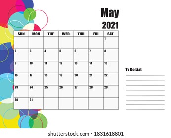 Calendario para mayo de 2021. El fondo blanco a la izquierda tiene círculos de varios tamaños y colores.