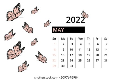 Calendar for May 2022. Desktop calendar with butterlies. Isolated on white background. Close-up. Week starts sunday.