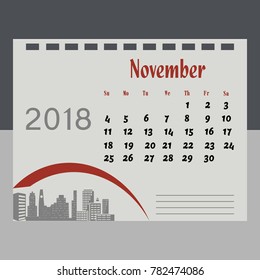 Calendar for November 2018 on grey with city skyscrapers