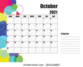 Calendar for October 2021. The white background on the left has circles of various sizes and colors.