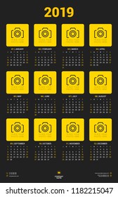 Calendar poster template for 2019 year. Week starts on Sunday. Stationery design. Vector calendar with place for photo on dark background