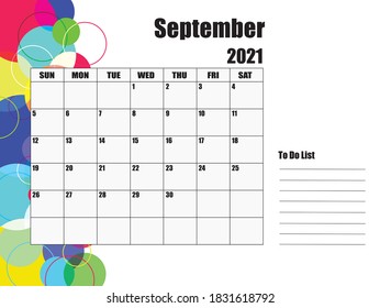 Calendar for September 2021. The white background on the left has circles of various sizes and colors.