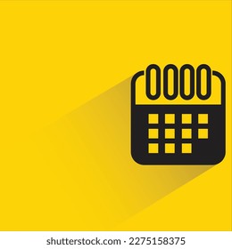 calendar with shadow on yellow background