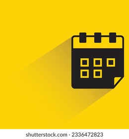 calendar with shadow on yellow background