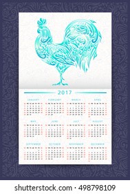 Calendar template 2017 with floral patterned rooster. Symbol of Chinese New Year. It may be used for design of a  postcard, wallpaper, planner,  poster, brochure and so on.  